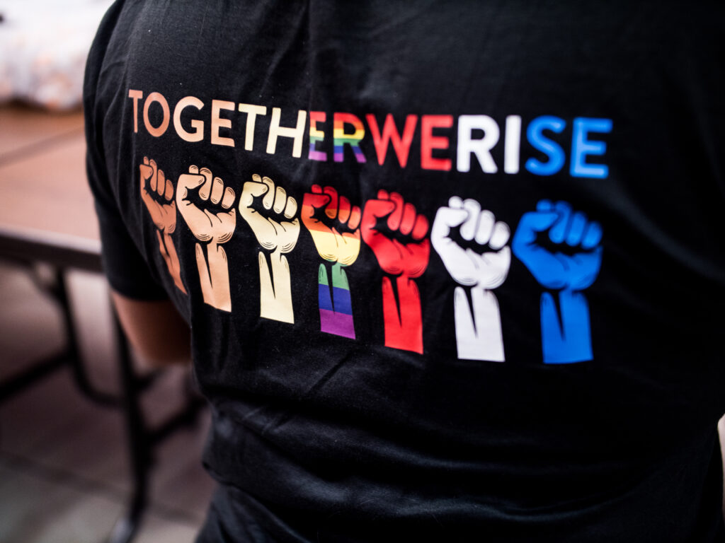 Shirt that says "Together we rise" on a woman at an overdose prevention training